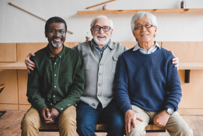 group of senior friends smiling at camera