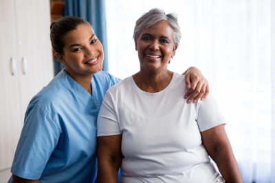 portrait of young nurse with senior patient